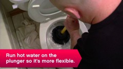 man plunging toilet